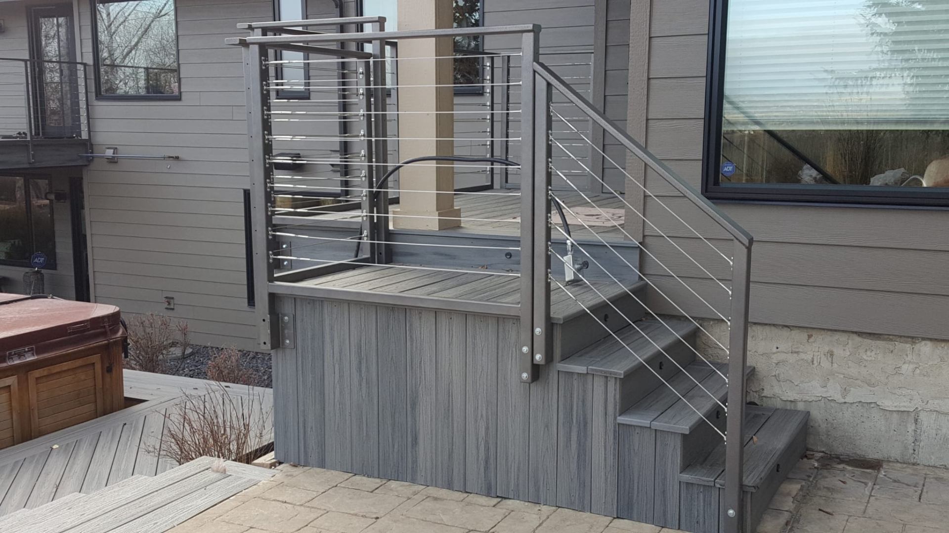 Custom deck staircase with cable railing