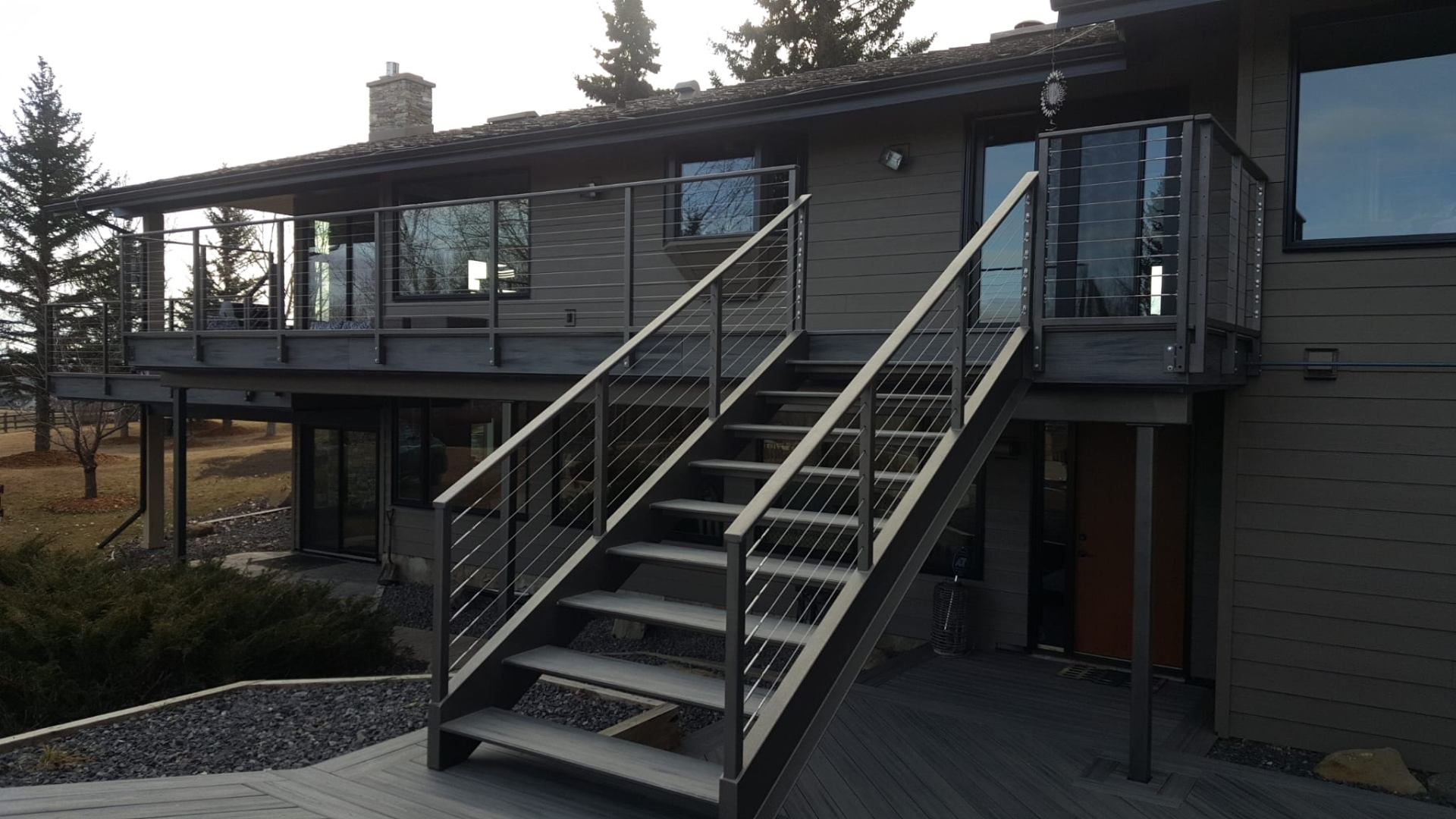 Exterior deck, staircase, and cable railing build